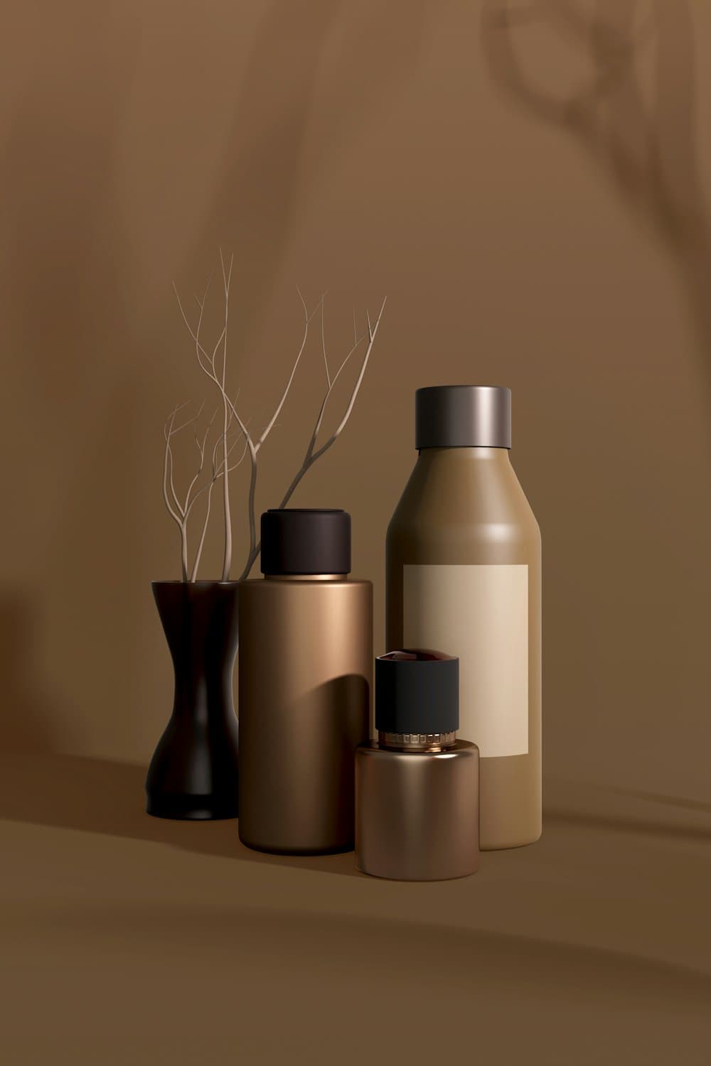 Three bronze and amber bottles of different heights grouped on a warm brown surface