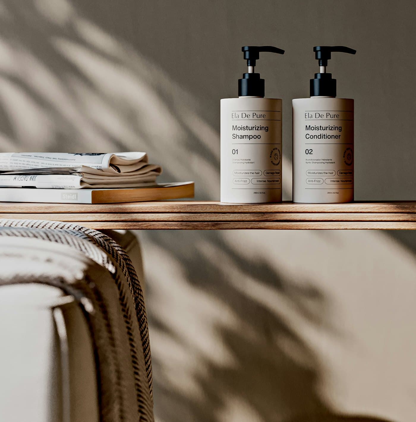 Two pump bottles of shampoo and conditioner on a wooden shelf in dappled sunlight