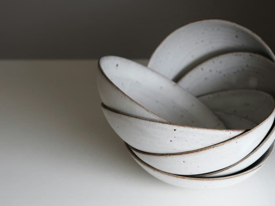 Shallow speckled bowls nested inside each other