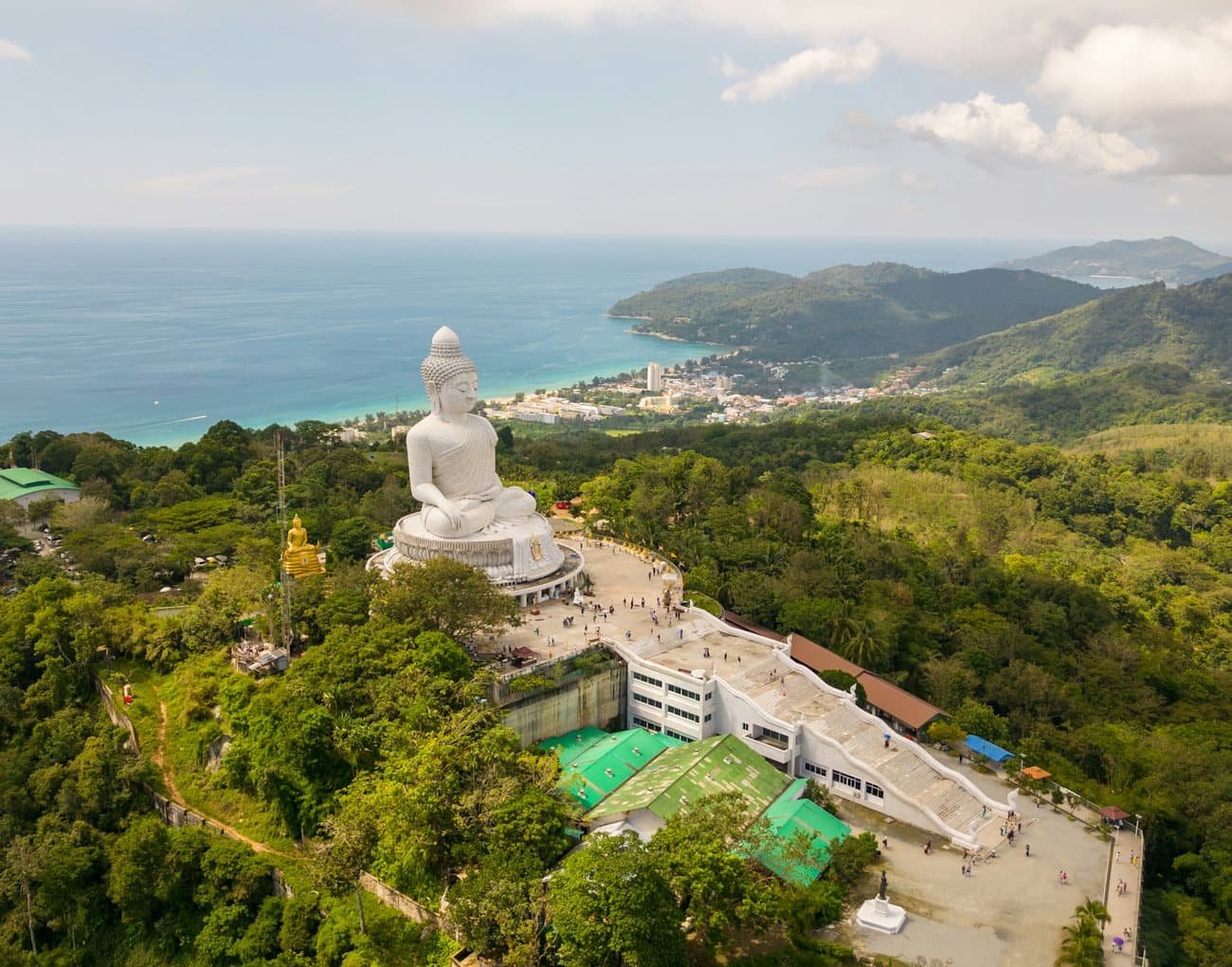 The white Big Buddha statue on its hilltop above the Phuket coast